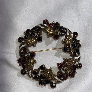Deep red and gold brooche pin